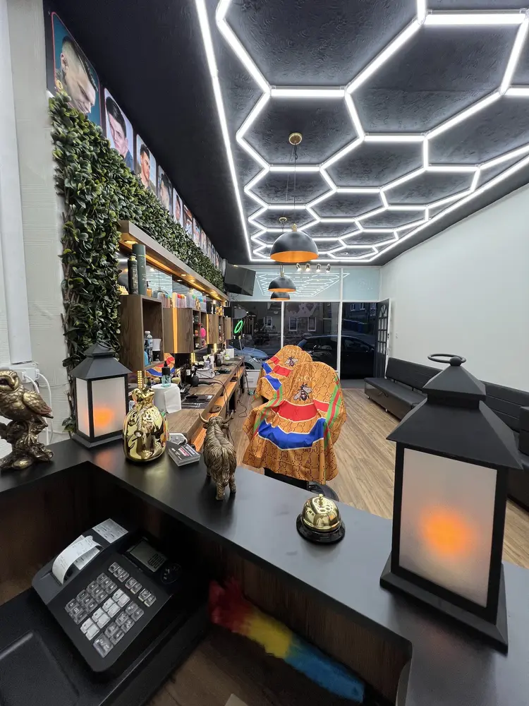 Reception desk with lanterns looking down the shop toward the door